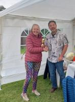 Ruth receiving her trophy for winning the treasure hunt.